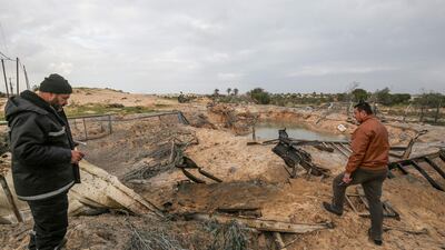 Palestinians inspect the site of an Israeli air strike in Rafah in the southern Gaza Strip on January 31, 2020. AFP