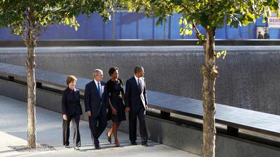 September 11, 2011. U.S. President Barack Obama (R), first lady Michelle Obama (2nd R), former U.S. President George W. Bush (2nd L) and former first lady Laura Bush walk beside the North pool of the WTC Memorial during ceremonies marking the 10th anniver???