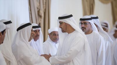 Sheikh Mohammed bin Zayed, Crown Prince of Abu Dhabi and Deputy Supreme Commander of the Armed Forces, right, and Major General Sheikh Khaled bin Mohammed bin Zayed, Chairman of the State Security Department, back right, offer condolences to the family of martyr Mohammed Al Humoodi who died while serving with the Armed Forces in ‘Operation Restoring Hope’. Mohammed Al Hammadi / Crown Prince Court - Abu Dhabi