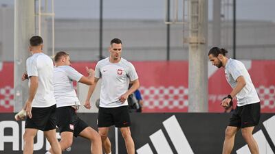 Arkadiusz Milik and Grzegorz Krychowiak take part in a training session at Al Kharaitiyat SC. AFP