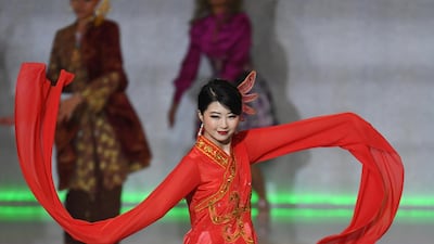 Miss Macau Yu Yanan performs during the final in the ExCel centre in London. EPA