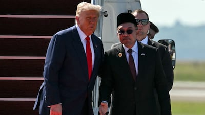 US President Donald Trump with Malaysia's Prime Minister Anwar Ibrahim at Kuala Lumpur International Airport. The US President arrived in Malaysia on October 26 on the first leg of an Asian tour that will include trade talks with Chinese President Xi Jinping. AFP