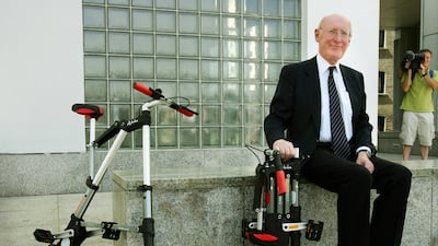 Sir Clive Sinclair poses for a photograph during the launch of his A-bike in 2006. AFP