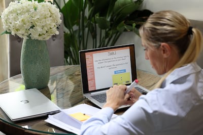 A Dubai teacher prepares for online lessons as distance learning continues. Chris Whiteoak / The National