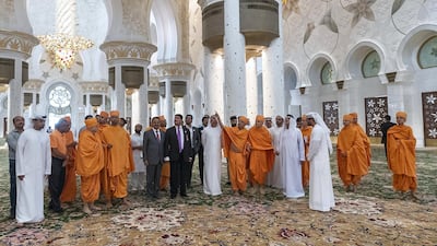 Mahant Swami Maharaj observes the inscriptions of the 99 auspicious names of Allah.