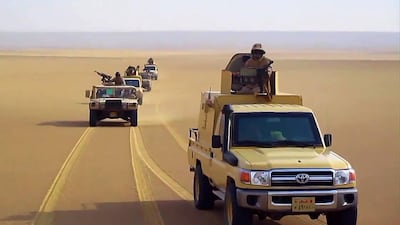 Egyptian army pick-up trucks and Humvees driving in the desert before it was announced joint war games will take place with Sudan later this month. AFP