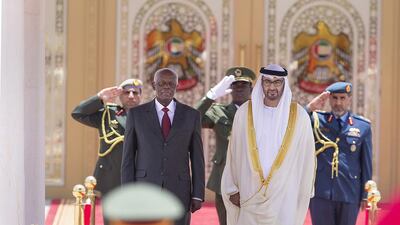 Sheikh Mohammed bin Zayed, Crown Prince of Abu Dhabi and Deputy Supreme Commander of the UAE Armed Forces and José Eduardo dos Santos, president of Angola, stand for the national anthem in Mushrif Palace on Sunday. Donald Weber / Crown Prince Court - Abu Dhabi