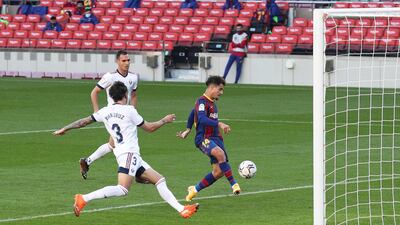 Barcelona's Philippe Coutinho scores on Sunday. Reuters