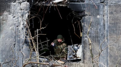 What used to be a window is now a gaping hole, after a Russian strike tore through an apartment building in Ukraine's capital, Kyiv. Reuters