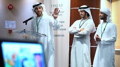 Ahmed Salah Al Marzouqi, left, discusses a business case study with his fellow students entrepreneurs. Delores Johnson / The National