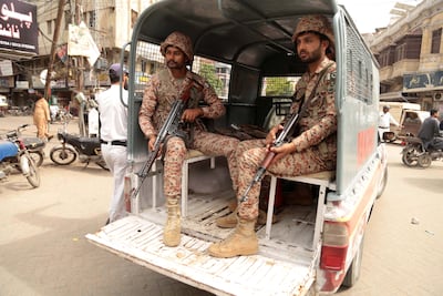 Pakistani security personnel patrol a street before the US-Iran peace talks. EPA