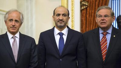 Senators Bob Corker, left, and Robert Menendez, right, of the Senate Foreign Relations Committee with the Syrian National Coalition president Ahmad Jarba in Washington on May 7, 2014. Jonathan Ernst / Reuters
