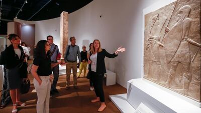 Becky Allen, curator of the A History of The World In 100 Objects exhibition, takes visitors through the show. Courtesy TCA Abu Dhabi