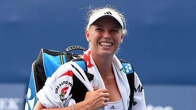 Caroline Wozniacki smiles after her second straight sets win in as many days. Julian Finney / Getty Images