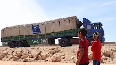 A lorry carrying aid packages drives through Hazano in the rebel-held northern countryside of Syria's Idlib province. AFP