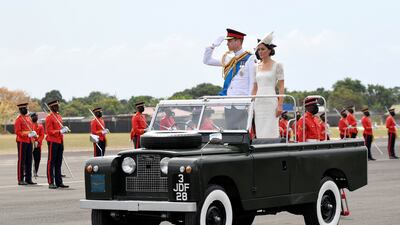 Britain's Prince William and his wife Kate in a vintage Land Rover used by Queen Elizabeth during her visit to Kingston, Jamaica, on the sixth day of their tour of the Caribbean. Reuters