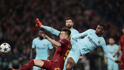 Barcelona defender Nelson Semedo, right, vies for the ball with Roma forward Stephan El Shaarawy during their Uefa Champions League quarter-final second-leg match in Rome. Isabella Bonotto / AFP
