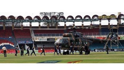 Members of the Sri Lankan cricket team board a rescue helicopter at the Qadafi Stadium on March 3 2009 in Lahore, Pakistan.