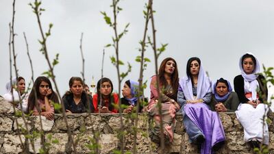 Iraqi Yazidi women sit outside the Temple of Lalish, in a valley near the Kurdish city of Dohuk about 430 kilometres northwest of the capital Baghdad, on April 16, 2019. AFP