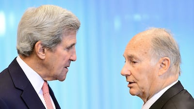 Former US State Secretary John Kerry, left, with the Aga Khan at the European Council in Brussels on October 5, 2016. AFP