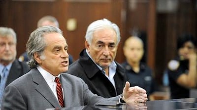 Dominique Strauss-Kahn, managing director of the International Monetary Fund (IMF), right, appears with attorney Benjamin Brafman at his arraignment in Manhattan criminal court in New York, U.S., on Monday, May 16, 2011. Strauss-Kahn, accused of attempting to rape a hotel housekeeper, was ordered held without bail by a New York judge. Mr Strauss-Kahn has resigned 'with infinite sadness'. Photographer: Andrew Gombert/Pool via Bloomberg