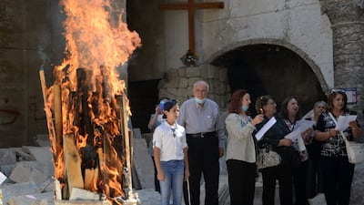 Worshippers during the inauguration ceremony for the new bell. AFP