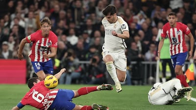 Atletico Madrid's Koke challenges Brahim Diaz of Real. AFP