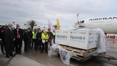 Officials inspect boxes of Sputnik V vaccines at Tunis-Carthage airport on Tuesday. EPA / Mohamed Messara