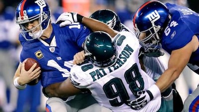 Eli Manning, the New York Giants quarterback, (10) was sacked three times in last night's loss to the Eagles.
