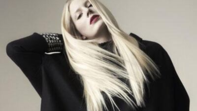 Cape, Dh6,332; jumper (worn underneath), Dh2,900, both Jil Sander at Harvey Nichols.