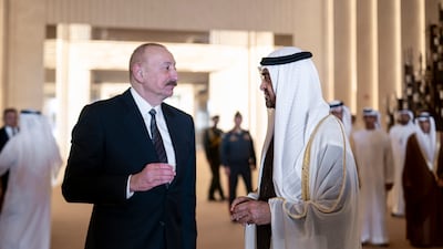 Sheikh Mohamed speaks with Mr Aliyev at the Presidential Airport