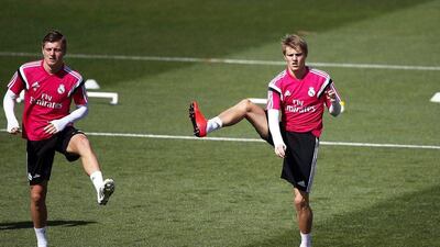 Martin Odegaard trains next to Toni Kroos at Real Madrid's team training session on Tuesday ahead of their Wednesday La Liga match against Almeria. Javier Lizon / EPA / April 28, 2015