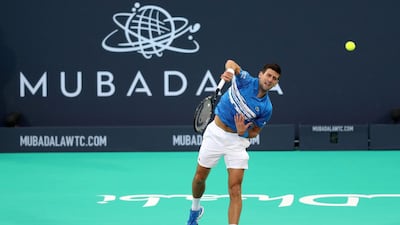 Novak Djokovic serves.
