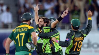 Pakistan's Shahid Afridi, centre, is surrounded by his teammates after taking South African cricketer Faf du Plessis (unseen) out for lbw during the second day-night international against South Africa in Dubai Cricket Stadium in Dubai on November 1. Asif Hassan / AFP