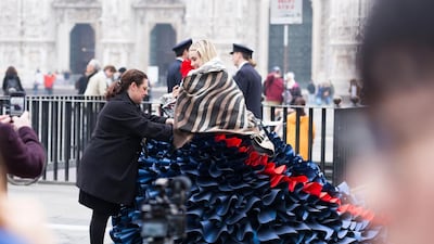Zoe Bradley does a final fitting with model Suki Waterhouse in a gown she designed for British Airways during Milan Fashion Week. Courtesy British Airways