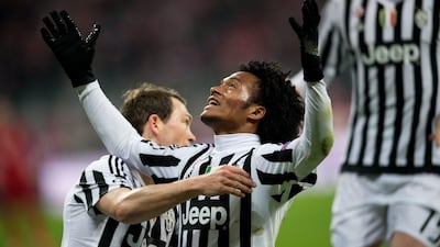 Juventus’ Juan Cuadrado (C) celebrates his 0-2 goal during the Uefa Champions League Round of 16 second leg match between Bayern Munich and Juventus, in Munich, Germany, 16 March 2016. EPA/SVEN HOPPE
