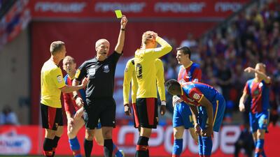 The game was always going to be a little scrappy with players putting their 100 per cent in. Here, the referee Martin Atkinson shows a yellow card to Watford's Joel Ekstrand after a foul. Richard Heathcote / Getty Images
