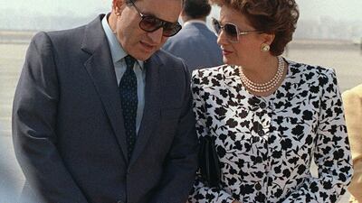 Egyptian President Hosni Mubarak speaks to his wife Susan, at Cairo airport, 11 October 1987 AFP