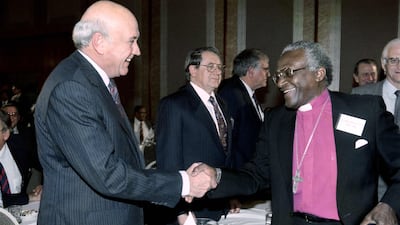 South Africa's former president Frederik Willem de Klerk shakes hands with Tutu at signing of the historic National Peace accord in 1991. AFP