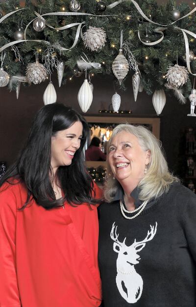 Lucy Gregory and her mum, Lynda Rutherford, sell custom-made Christmas wreaths. Chris Whiteoak / The National
