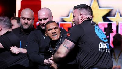 MANCHESTER, ENGLAND - FEBRUARY 25: Conor Benn is seen with egg on his face whilst being held back by a member of security after Chris Eubank Jr (not pictured) throws an egg at him during a press conference at Manchester Central on February 25, 2025 in Manchester, England. (Photo by Alex Livesey / Getty Images)