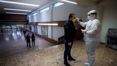 A medic tests a man for coronavirus during nationwide testing in Bratislava. Slovakia has begun a programme to screen its entire population for coronavirus. AFP