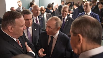 US Secretary of State Mike Pompeo (L) and Russian President Vladimir Putin talk on the sidelides of a Peace summit on Libya in Berlin. AFP