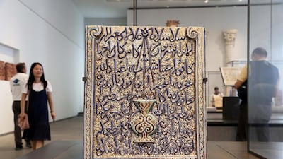 Fragment of a plaque in the form of a mihrab, Central Asia, 1250-1350: There is very little historical information accompanying this large broken slab of lusterware depicting a mihrab (the niche in the wall of a mosque indicating the qibla or direction of Mecca) but it really doesn’t matter. Instead, you should just bathe in the deep blues and turquoises, which shimmer beneath a metallic glaze, and marvel at the elaborate swirls decorating the central lamp (a reference to the Quranic surah about light). Photo: Pawan Singh / The National