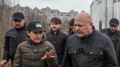International Criminal Court prosecutor Karim Khan and Ukraine's prosecutor general Iryna Venediktova visit the site of a mass grave in Bucha, Ukraine, in April. Reuters