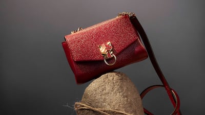 Bag, price on request, Cartier; pink gold and diamond rings, from left: Dh16,725; Dh17,119; Dh30,697, all Repossi; flower, Fine Blooms