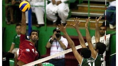 The UAE, in red, "showed lot of promise" but went down to Pakistan in four sets on the opening day at Al Shabab Club in Dubai. Lee Hoagland / The National