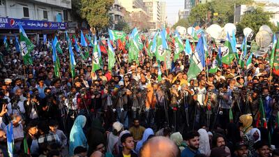 PTI and TLP supporters in Karachi. EPA