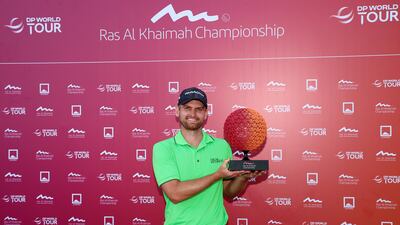 Daniel Gavins with the Ras Al Khaimah Championship trophy after his victory. Getty