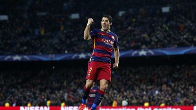 Luis Suarez of Barcelona celebrates after scoring the third goal in Barca’s 6-1 win over AS Roma on Tuesday night in the Champions League. Manu Fernandez / AP